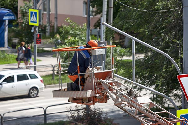 man working on electric panel